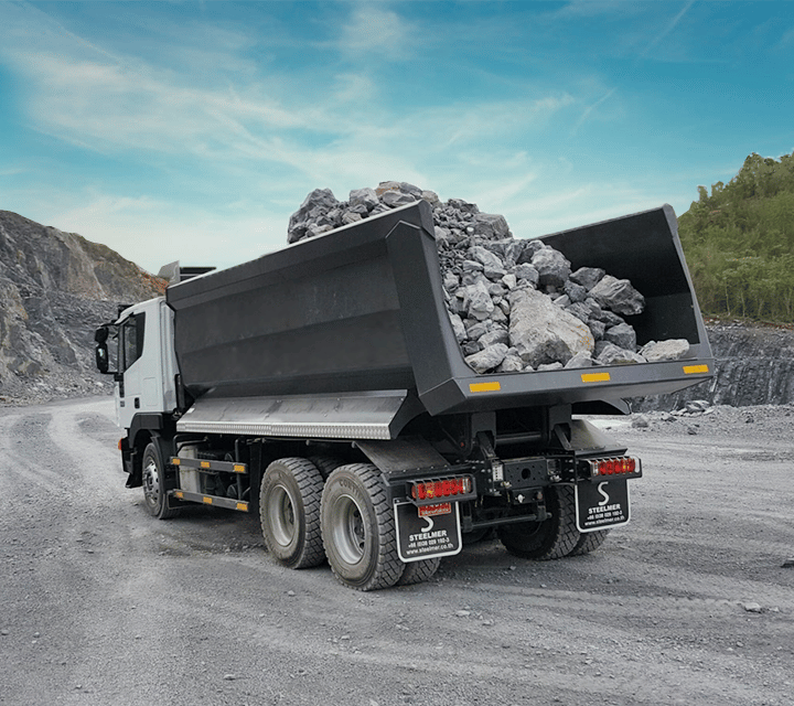 scow end tipper refers to a flat or slightly sloped end of a truck or trailer, typically used for transporting bulk materials like sand or gravel. Its design allows for easy unloading by tipping the contents out through the back.