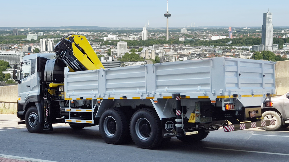 Cargo and crane truck 6x4 equipped with HYVA articulated knuckle-boom crane.